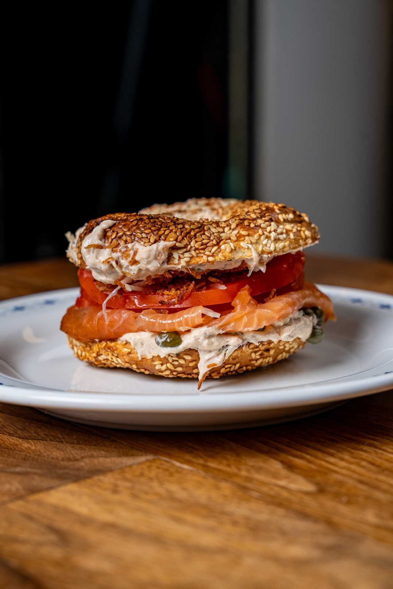 Farm-to-table dining in Qu&eacute;bec: A bagel stacked with cream cheese, capers and smoked salmon at Chez Greenberg
