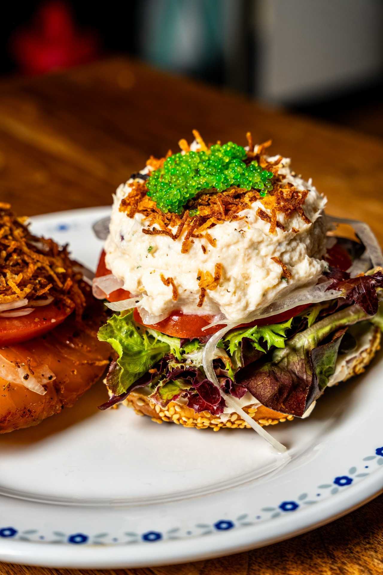 Farm-to-table dining in Qu&eacute;bec: An open-face bagel stacked with cream cheese, capers and smoked salmon at Chez Greenberg