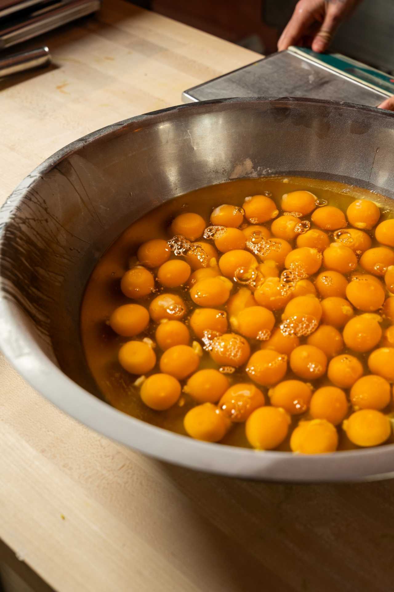 Farm-to-table dining in Qu&eacute;bec: A stove of fruit simmers at Pasta Pooks in Montreal