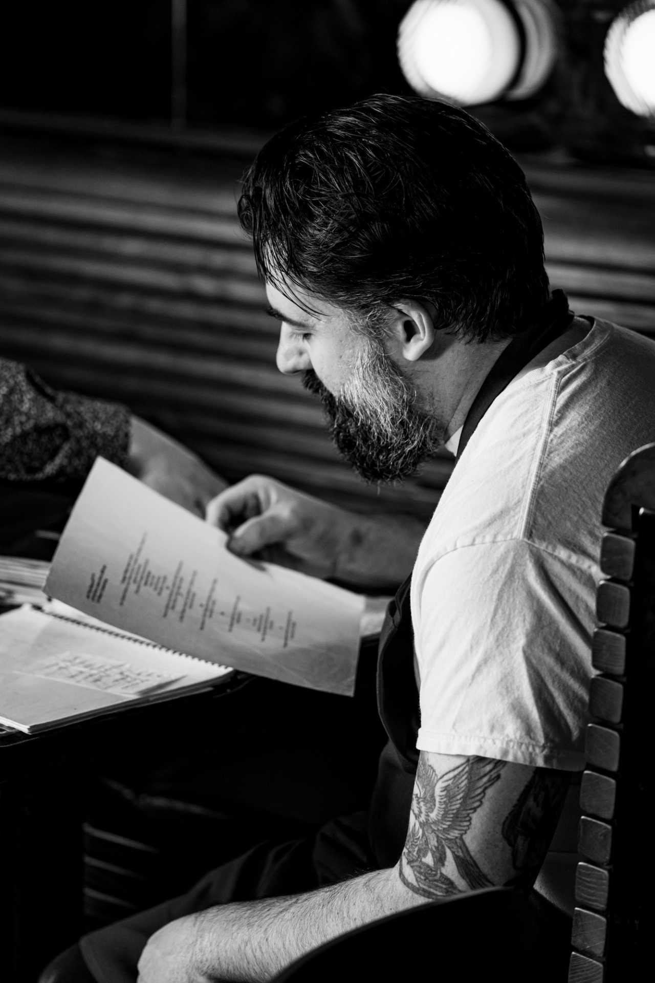 Pasta Privato Toronto | Chef Michael Angeloni reads a menu at Pasta Privato in Toronto