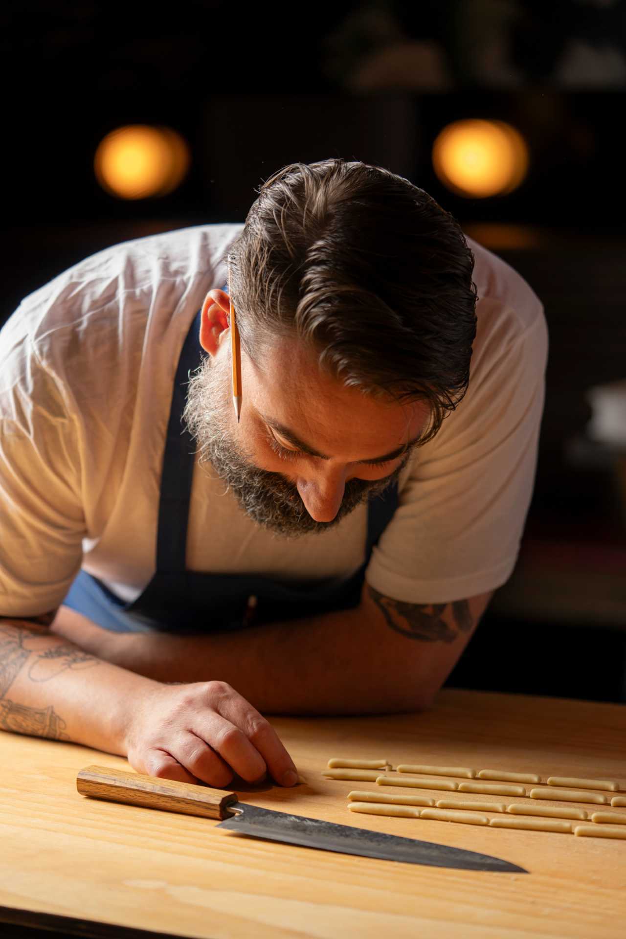 Pasta Privato Toronto | Chef Michael Angeloni admires handcut pasta at Pasta Privato in Toronto
