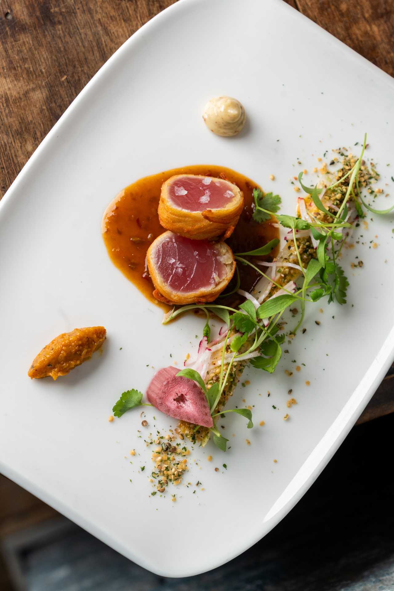 George Restaurant | Crispy-wrapped rare tuna with sauce, pickled vegetables, herb crumb and aioli.