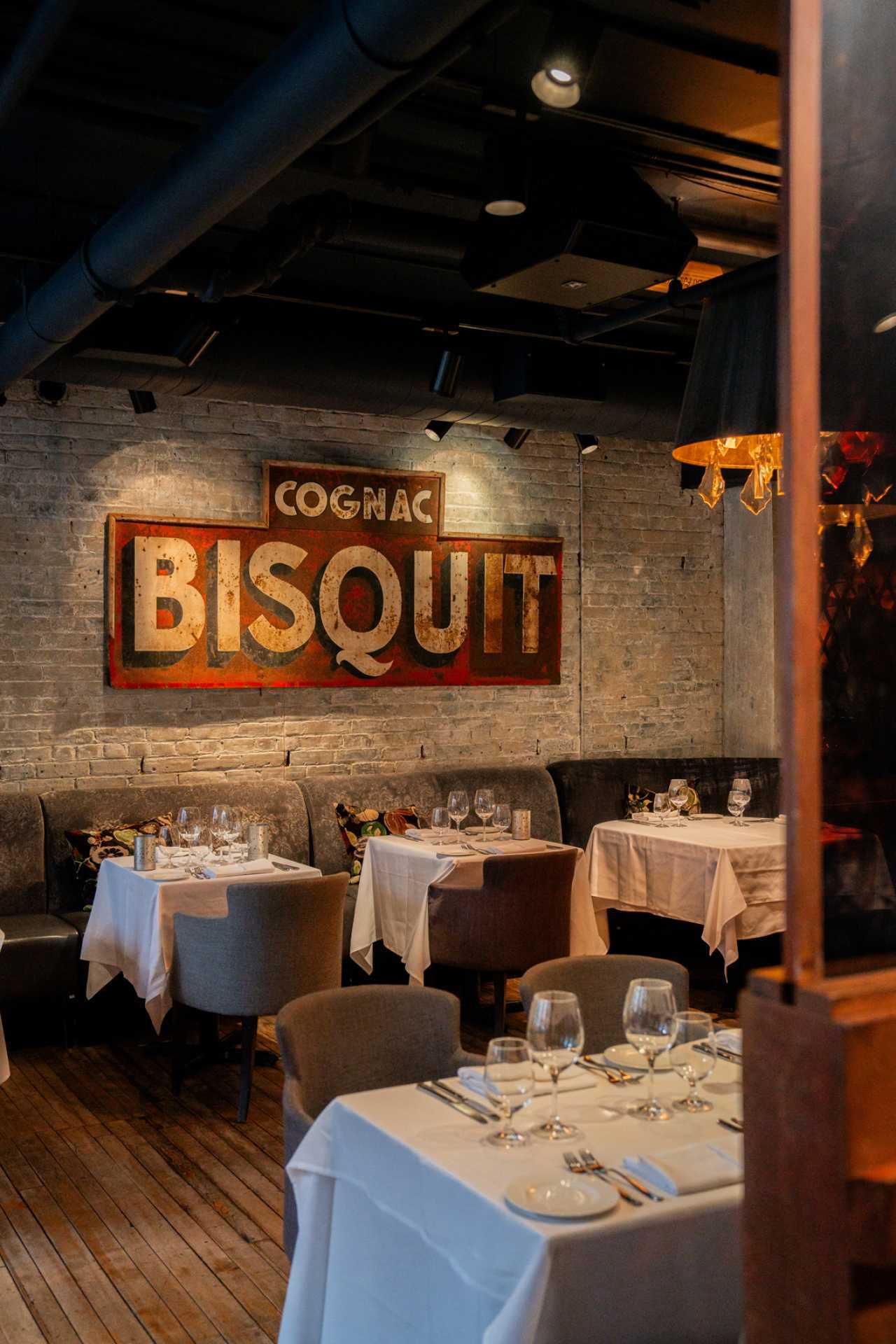 George Restaurant | A Cafe Bisquit sign on the wall of the dining room at George Restaurant