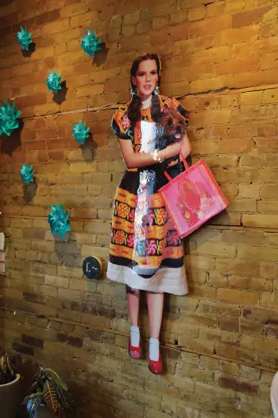 Best restaurants Toronto | An art installation of Dorothy in The Wizard of Oz inside La Bartola