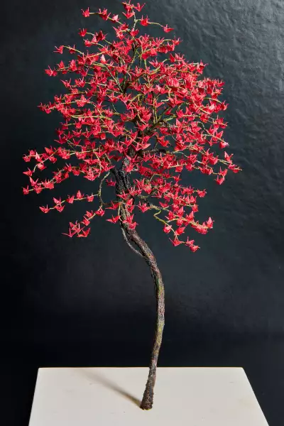 Sushi Yugen omakase in Toronto | A tree sculpture with hand-folded cranes