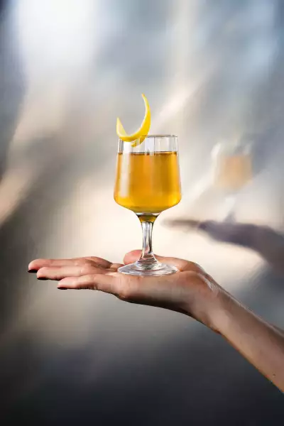 Friendly Reminder cocktail at Lisbon Hotel with rum, a house banana liqueur, Amontillado Sherry, toasted sesame and lime