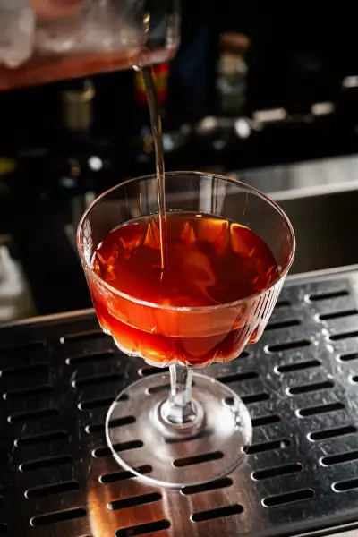 Borrowed Time cocktail at Lisbon Hotel, with tequila, campari, a house coffee liqueur, benedictine and chocolate bitters