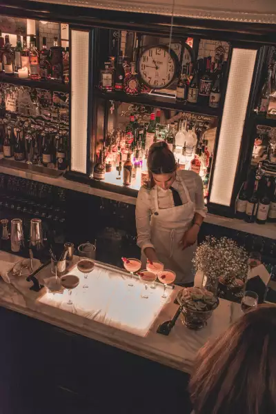 Cafe Renée, Toronto | An overhead shot of a bartender making drinks at Cafe Renée