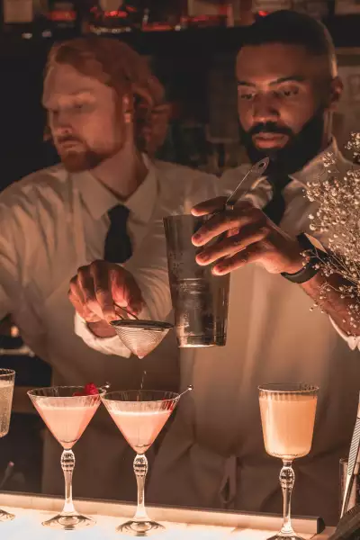 Cafe Renée, Toronto | A bartender making cocktails at Cafe Renée