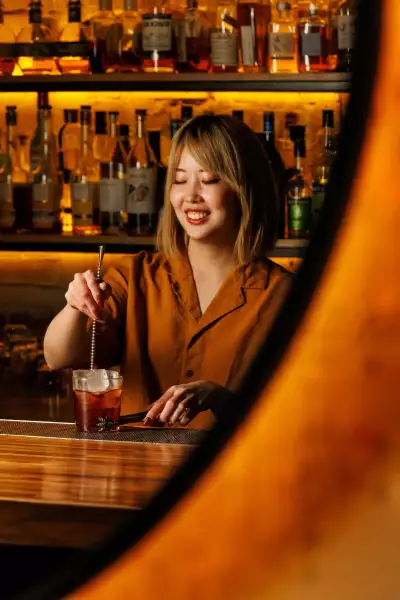 The best bars in Toronto | A bartender stirring a cocktail at Cry Baby Gallery