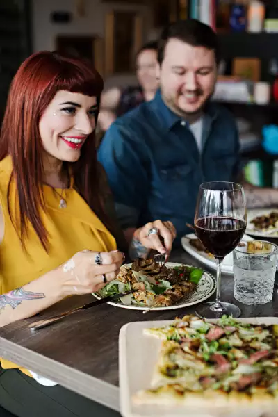 Canada Beef | A couple enjoy food and a glass of red wine