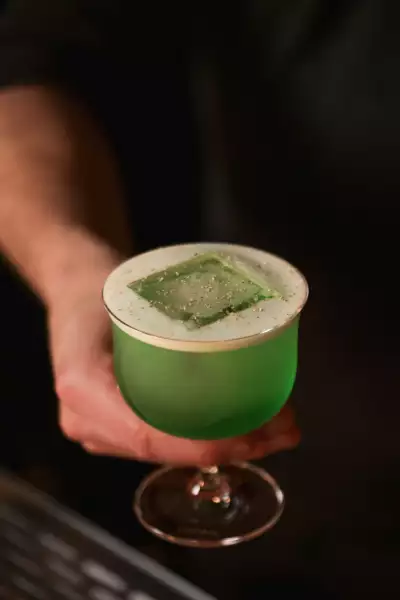 The best bars in Toronto | A green cocktail at Bar Banane