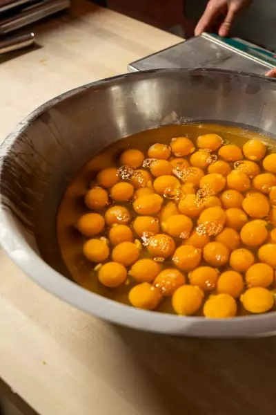 Farm-to-table dining in Qu&eacute;bec: A stove of fruit simmers at Pasta Pooks in Montreal