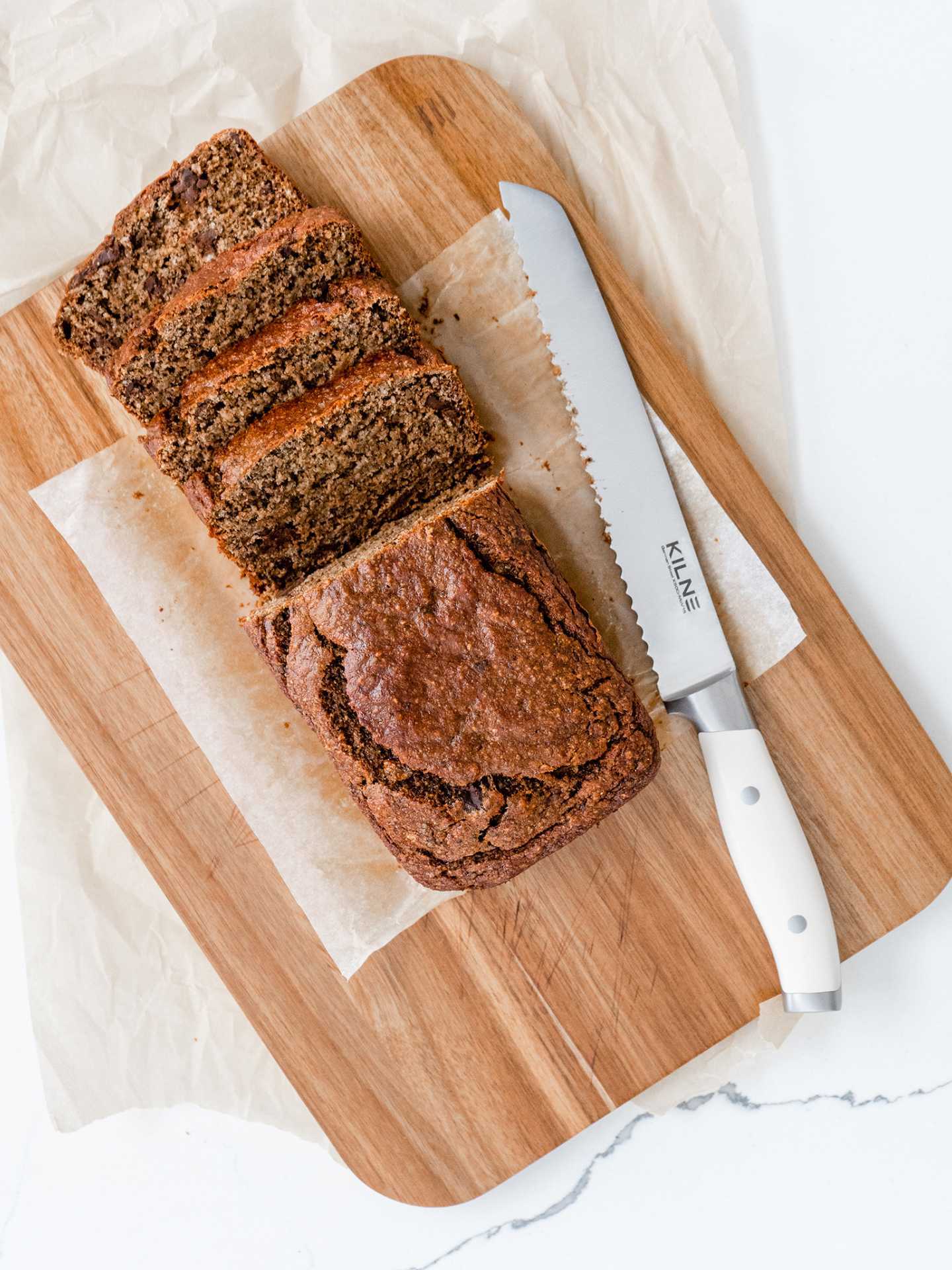Kilne Ultimate Knife set review | Kilne eight inch bread knife with sliced loaf of bread Kilne Ultimate Knife set review | Kilne eight inch bread knife with sliced loaf of bread