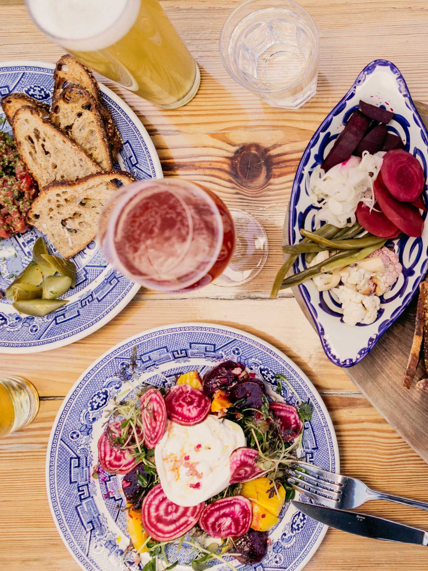 Toronto breweries | An assortment of dishes and drinks at Burdock Brewery