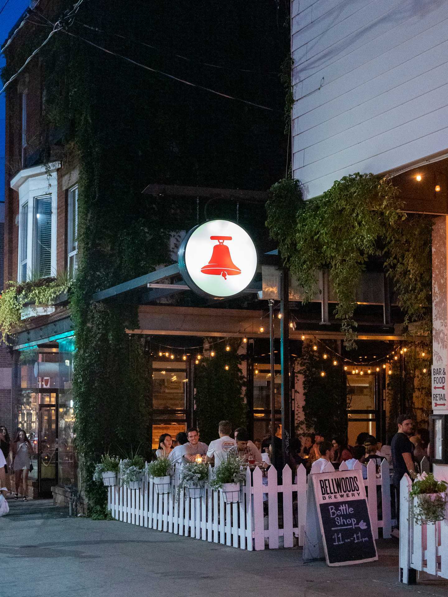 Toronto breweries | The patio and hanging sign outside Bellwoods Brewery