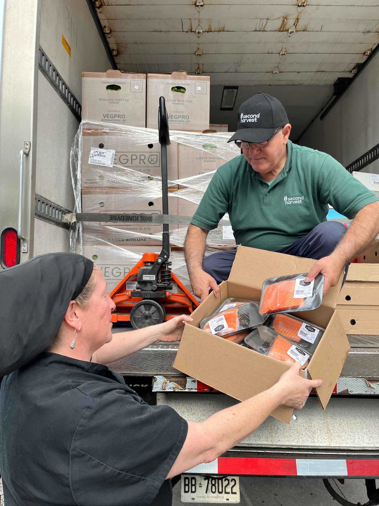 Second Harvest volunteers transporting rescued food