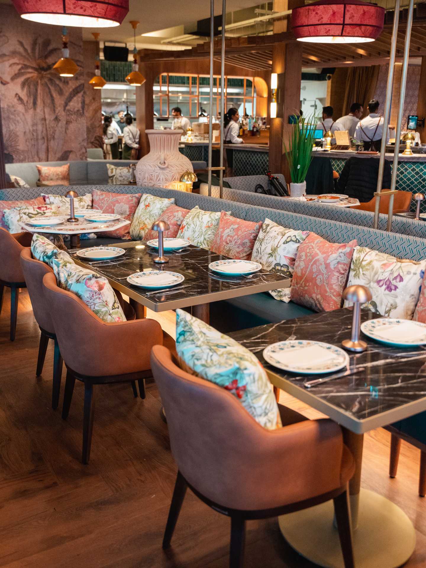 Best new Toronto restaurants | Pink floral pillows on a banquette inside Mishree Best new Toronto restaurants | Pink floral pillows on a banquette inside Mishree