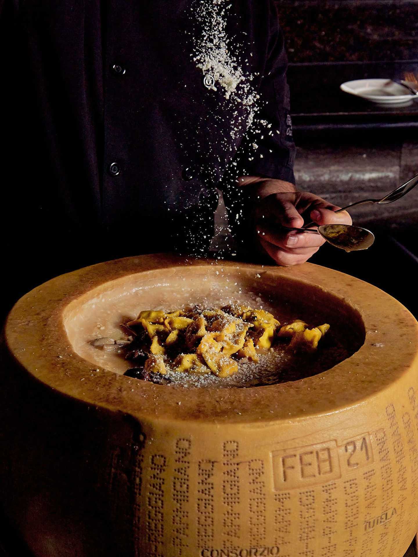 Via Allegro Ristorante | Sprinkling cheese onto the short rib agnolotti at Via Allegro Via Allegro Ristorante | Sprinkling cheese onto the short rib agnolotti at Via Allegro