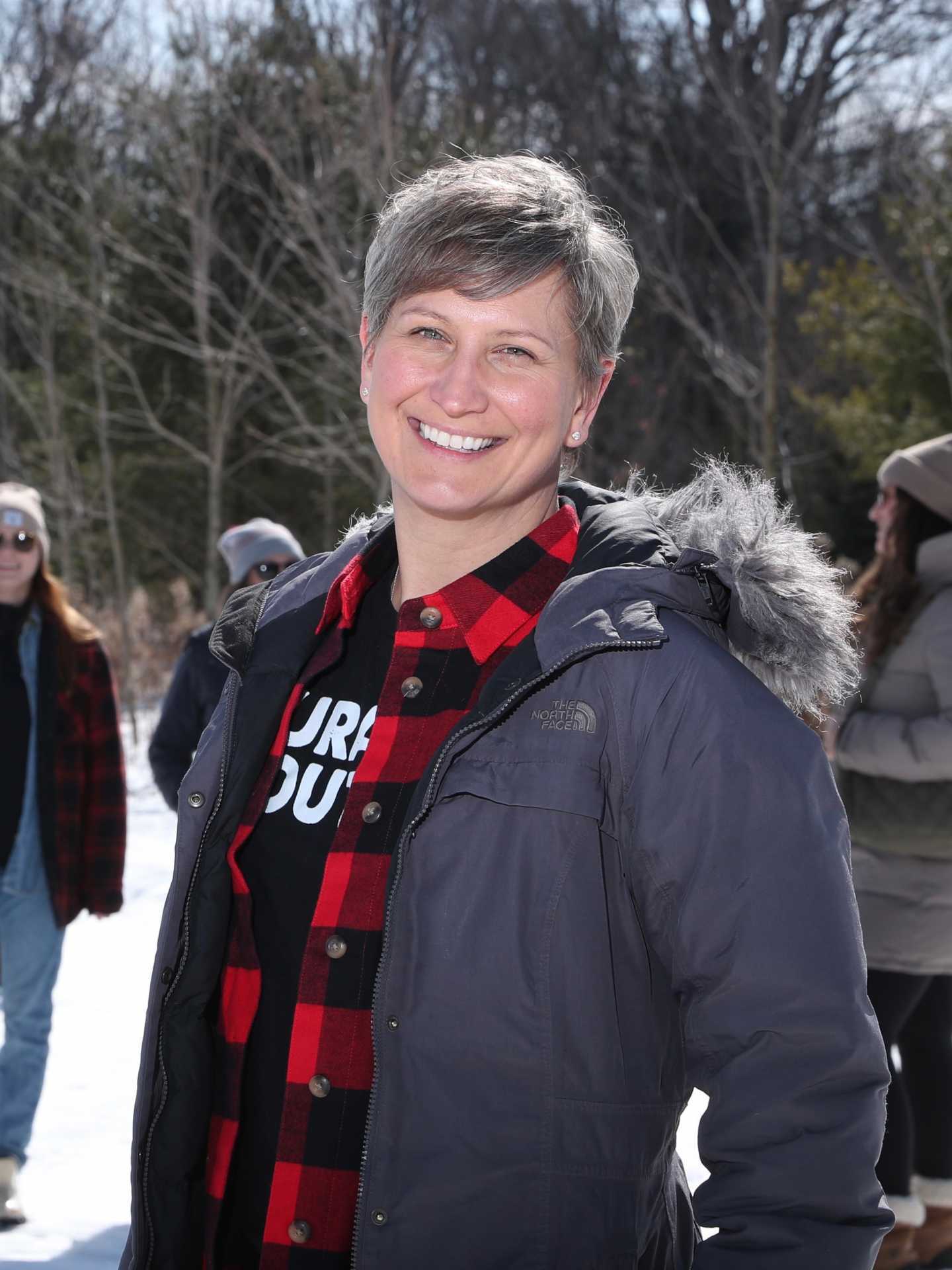 Rural Route Tour Co. maple syrup farm tour | Tamara Stefek smiling in a snowy forest Rural Route Tour Co. maple syrup farm tour | Tamara Stefek smiling in a snowy forest
