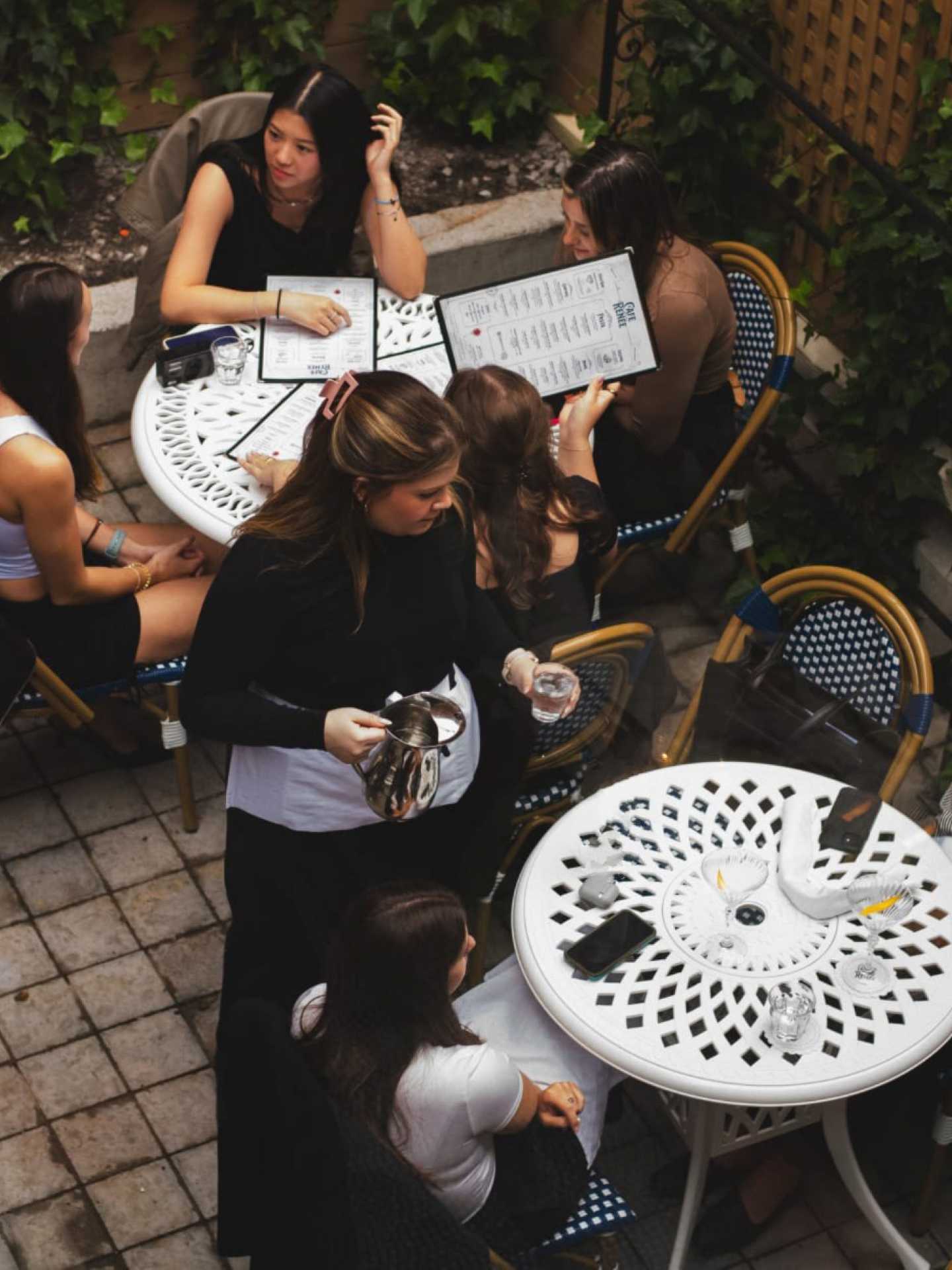 The best downtown Toronto restaurants | Servers giving drinks to guests at Cafe Renée