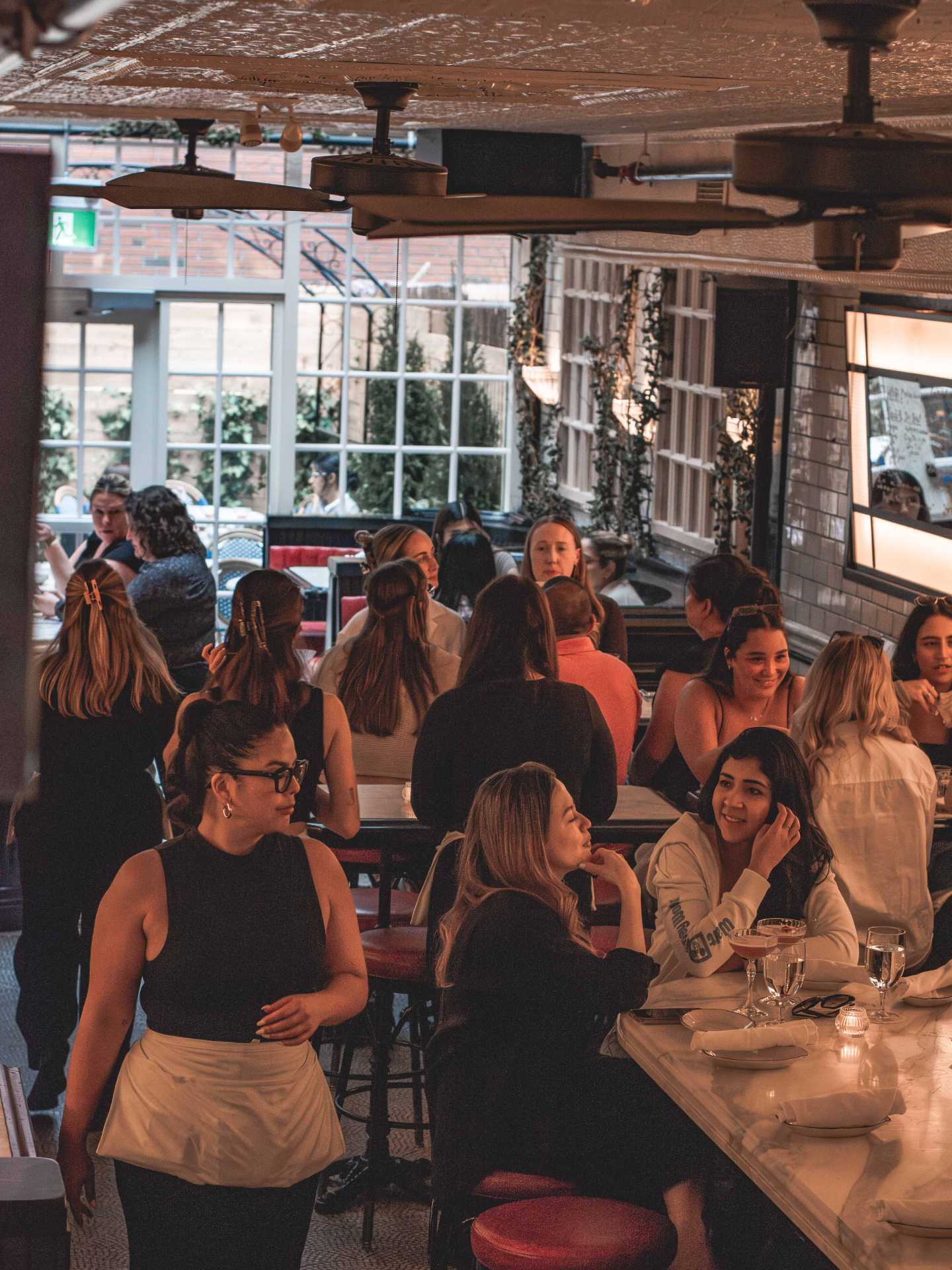 The best downtown Toronto restaurants | Guests enjoying food and chatting at Cafe Renée
