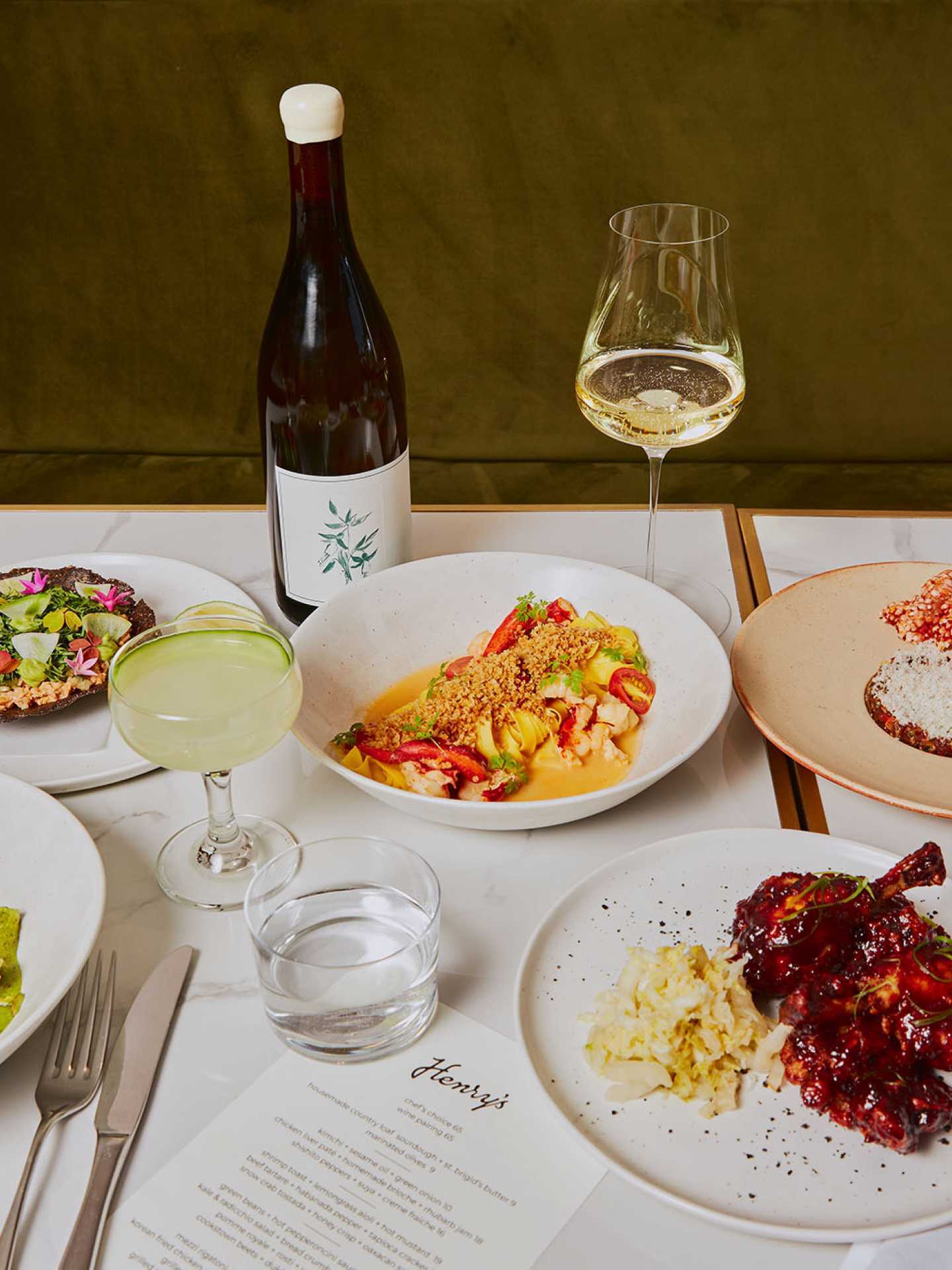 Dishes, wine and a cocktail at Henry's restaurant Toronto
