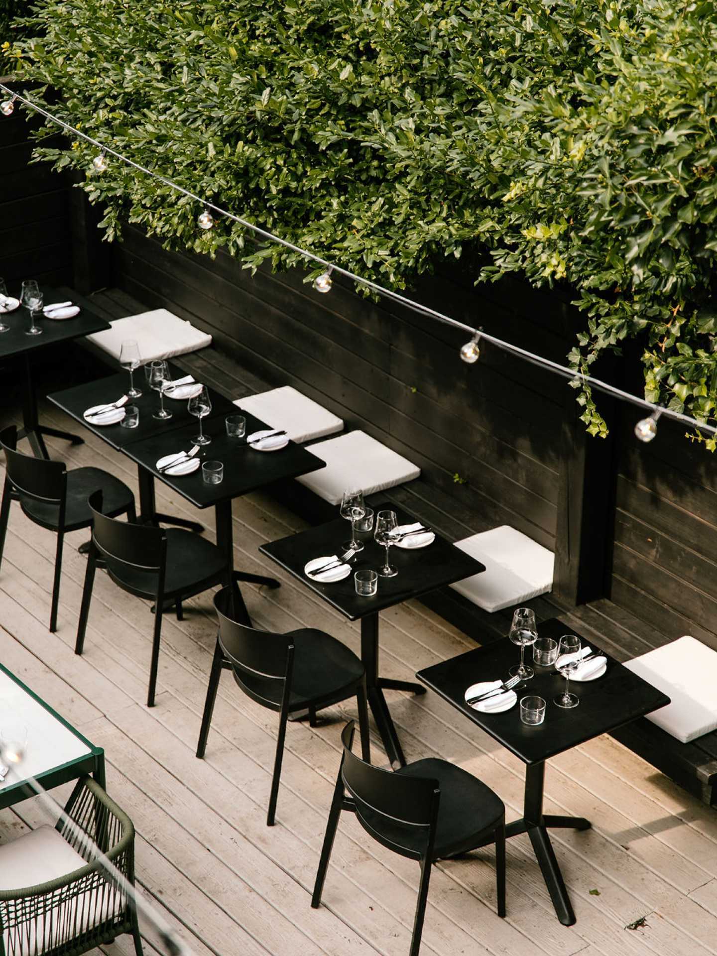 An overhead view of tables on the patio at Henry's restaurant Toronto