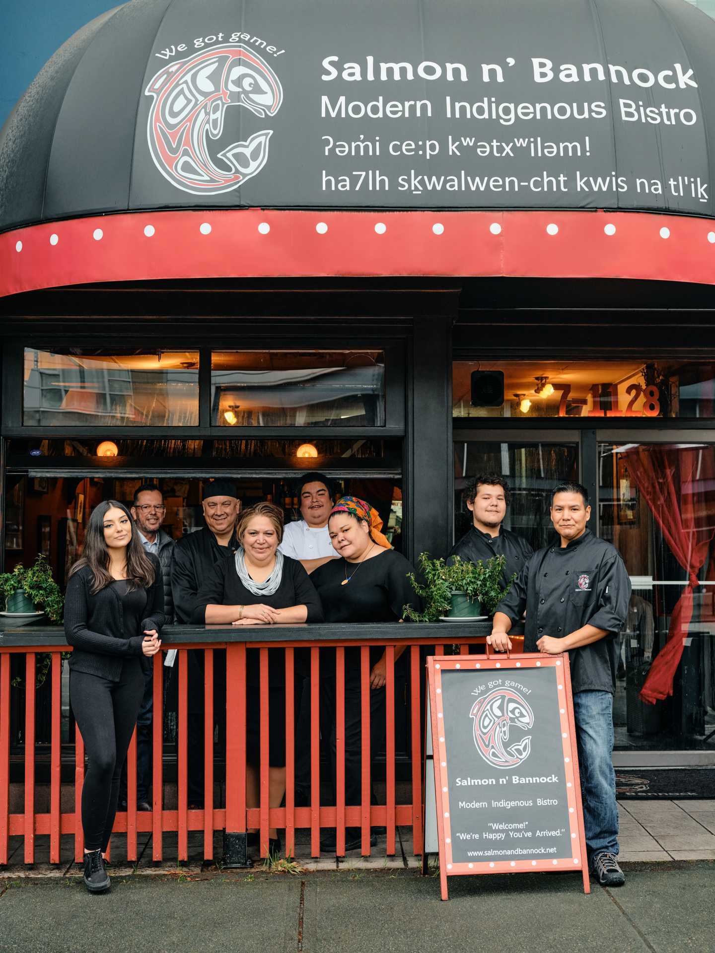 Indigenous food experiences in Canada | Owner Inez Cook and the team standing outside Salmon 'n' Bannock in Vancouver Indigenous food experiences in Canada | Owner Inez Cook and the team standing outside Salmon 'n' Bannock in Vancouver