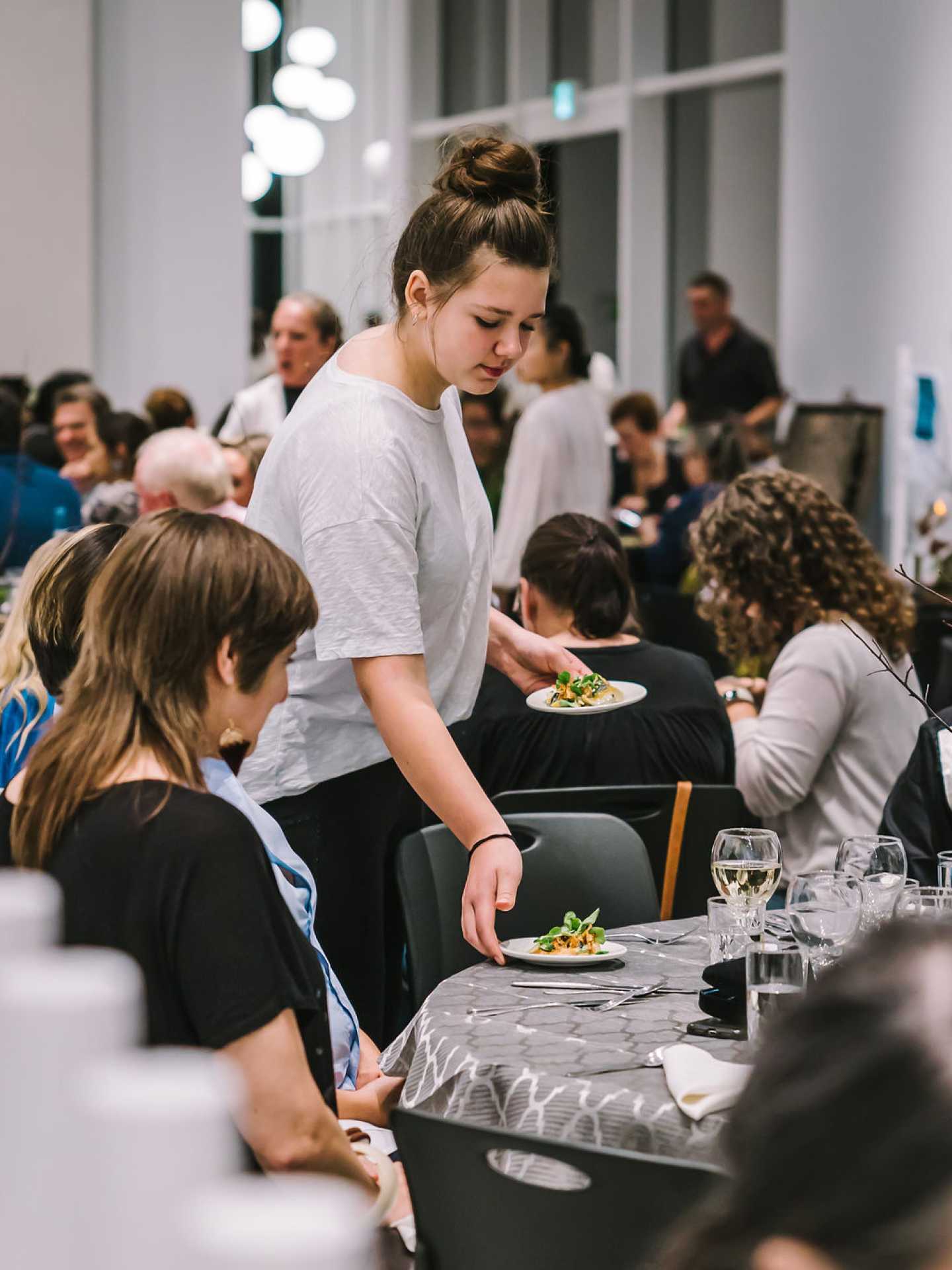 Indigenous food experiences in Canada | Serving a table at A Taste of the Atlantic