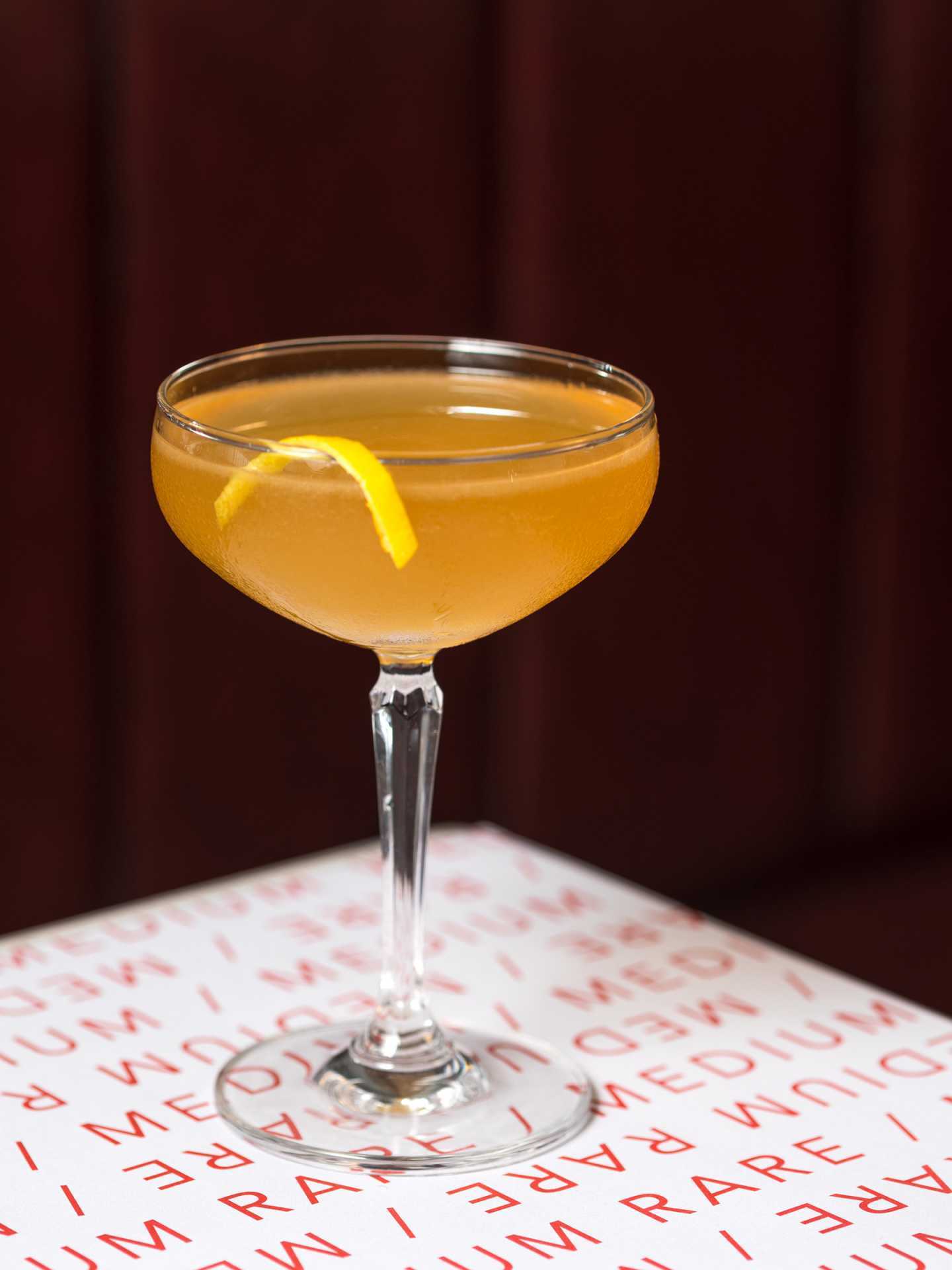 Best new Toronto restaurants | A yellow cocktail at J's Steak Frites