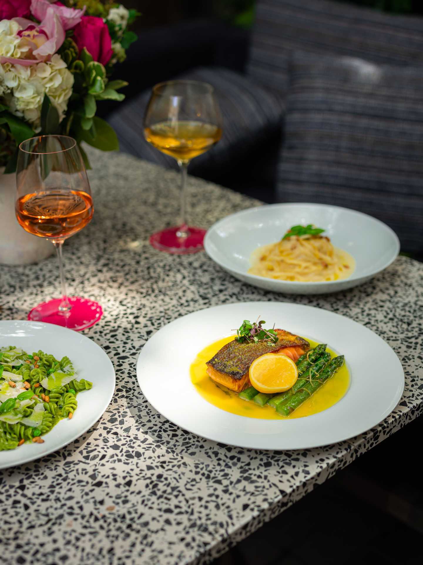 Italian restaurants Toronto | A spread of dishes and wine on the patio at Sofia Italian Restaurant Toronto
