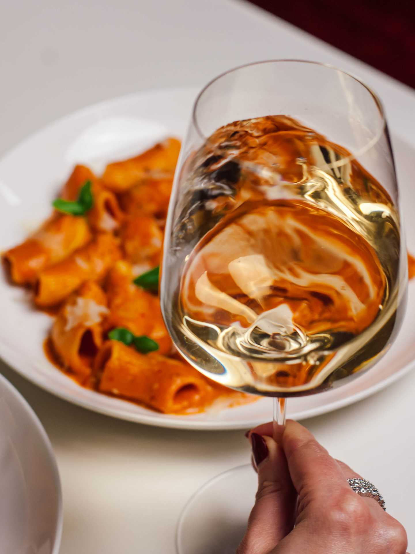 Italian restaurants Toronto | A glass of wine and rigatoni alla vodka at Sofia in Yorkville