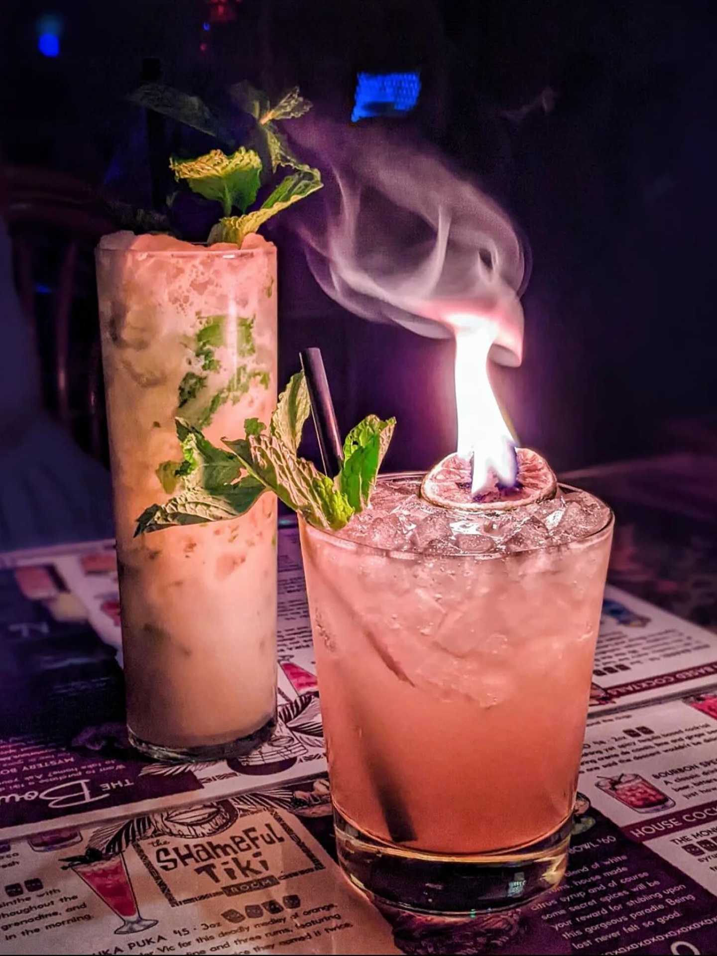 The best bars in Toronto | A flaming tiki cocktail and a creamy cocktail at The Shameful Tiki Room The best bars in Toronto | A flaming tiki cocktail and a creamy cocktail at The Shameful Tiki Room