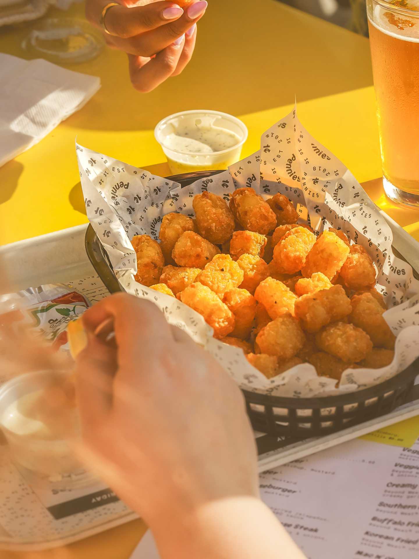 The best bars in Toronto | A basket of tater tots at Pennies