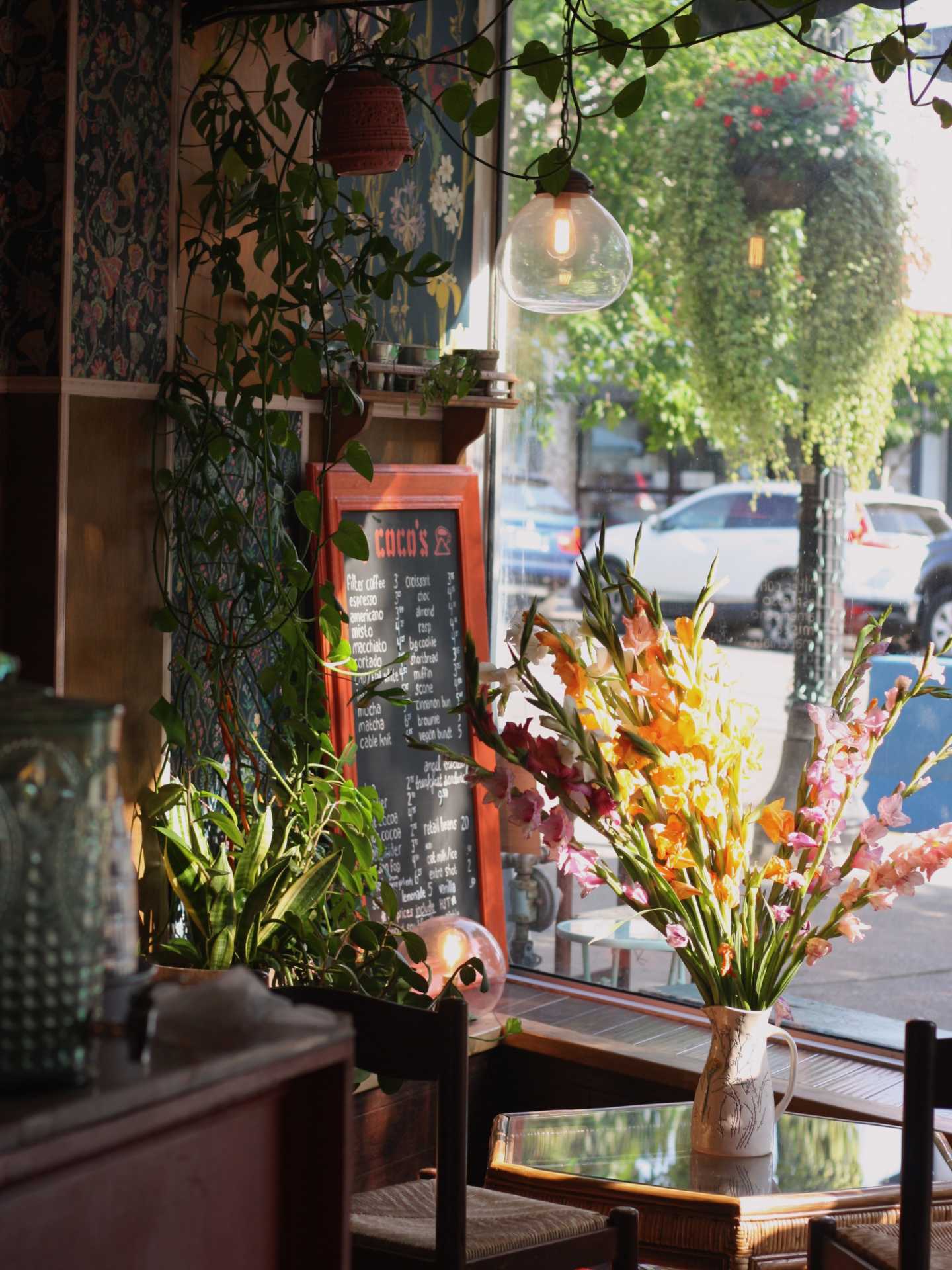 The best cafes in Toronto | Flowers and greenery at Coco's neighbourhood coffee shop