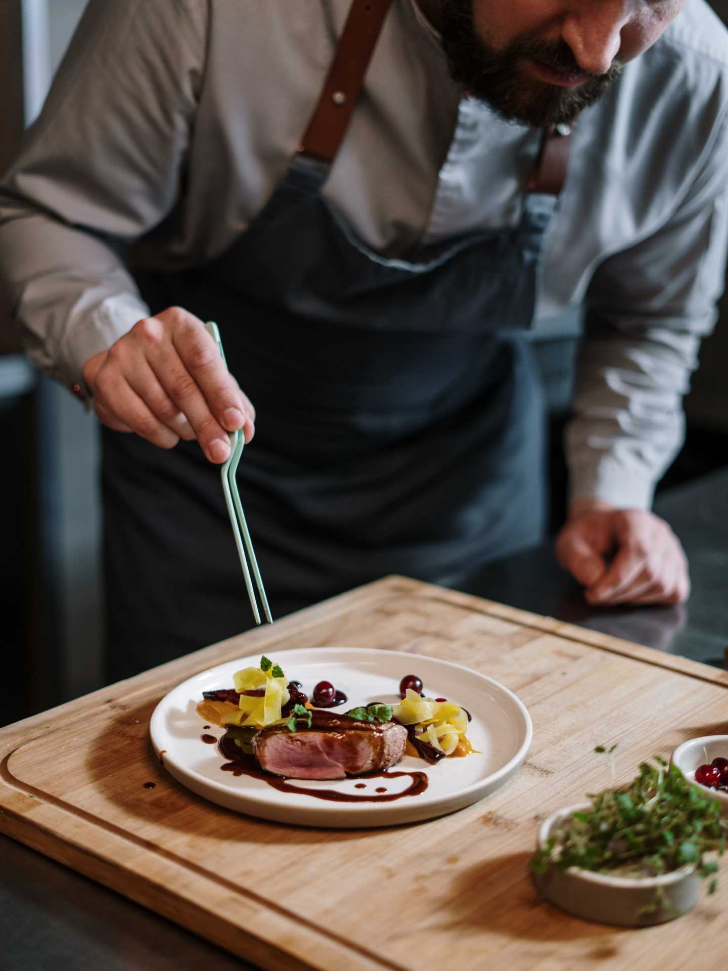 A chef preparing a plate A chef preparing a plate