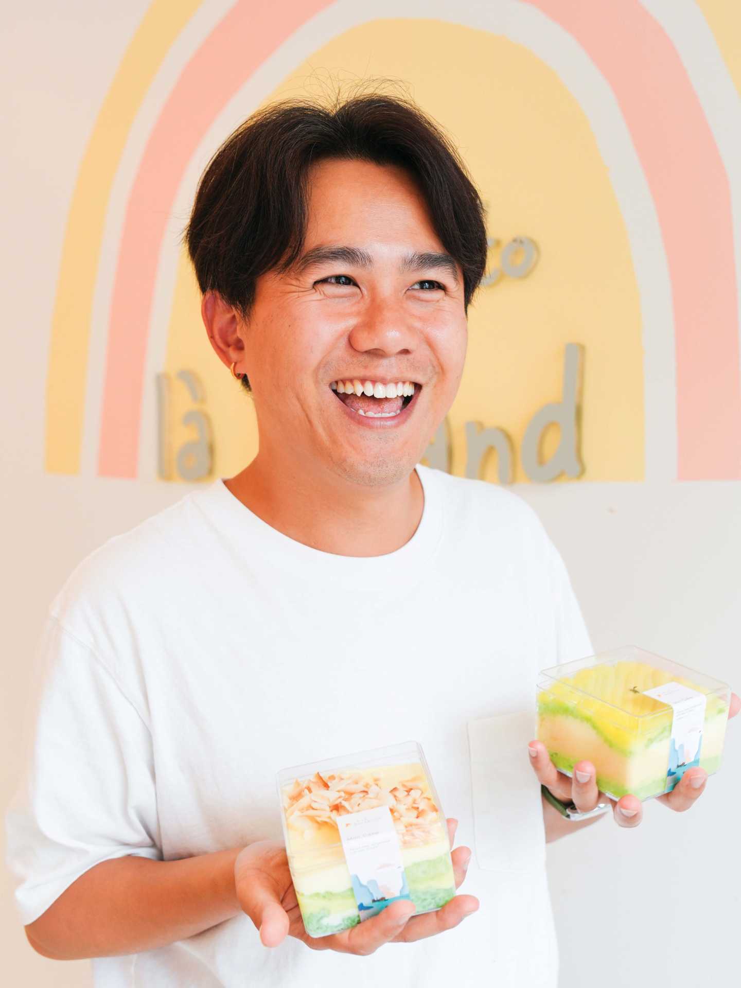 Brian Tran holding treats from Là Lá Bakeshop Brian Tran holding treats from Là Lá Bakeshop