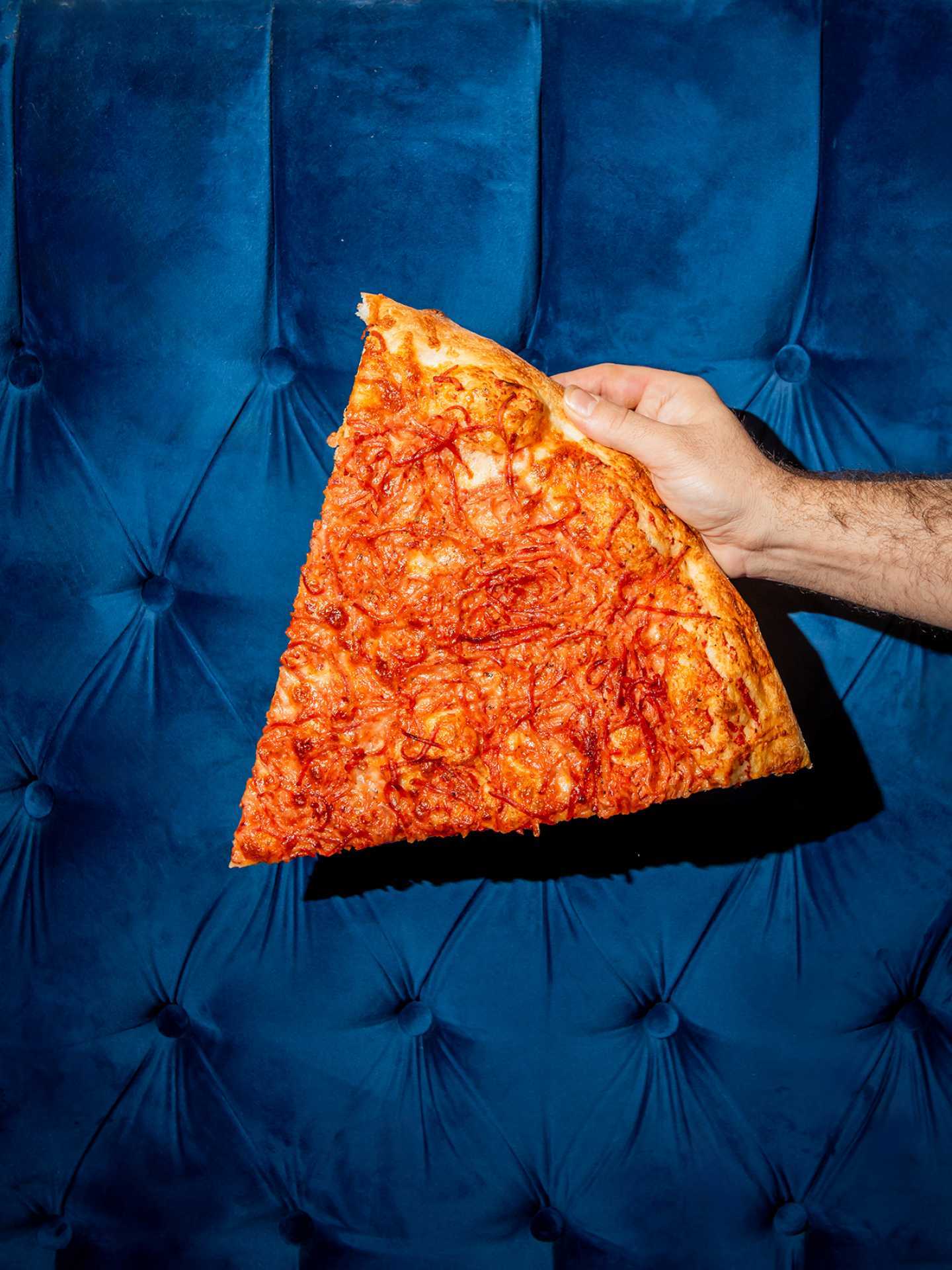 Toronto pizza | A slice of shredded pepperoni pizza at Ambassador Pizza Co.
