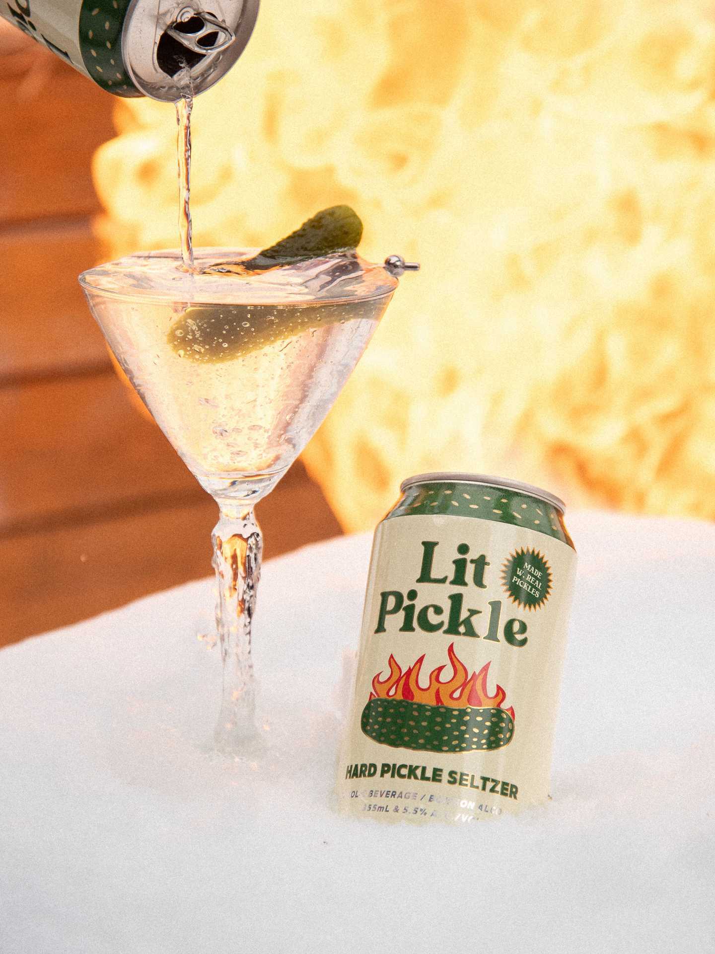 A can of Lit Pickle with a martini A can of Lit Pickle with a martini