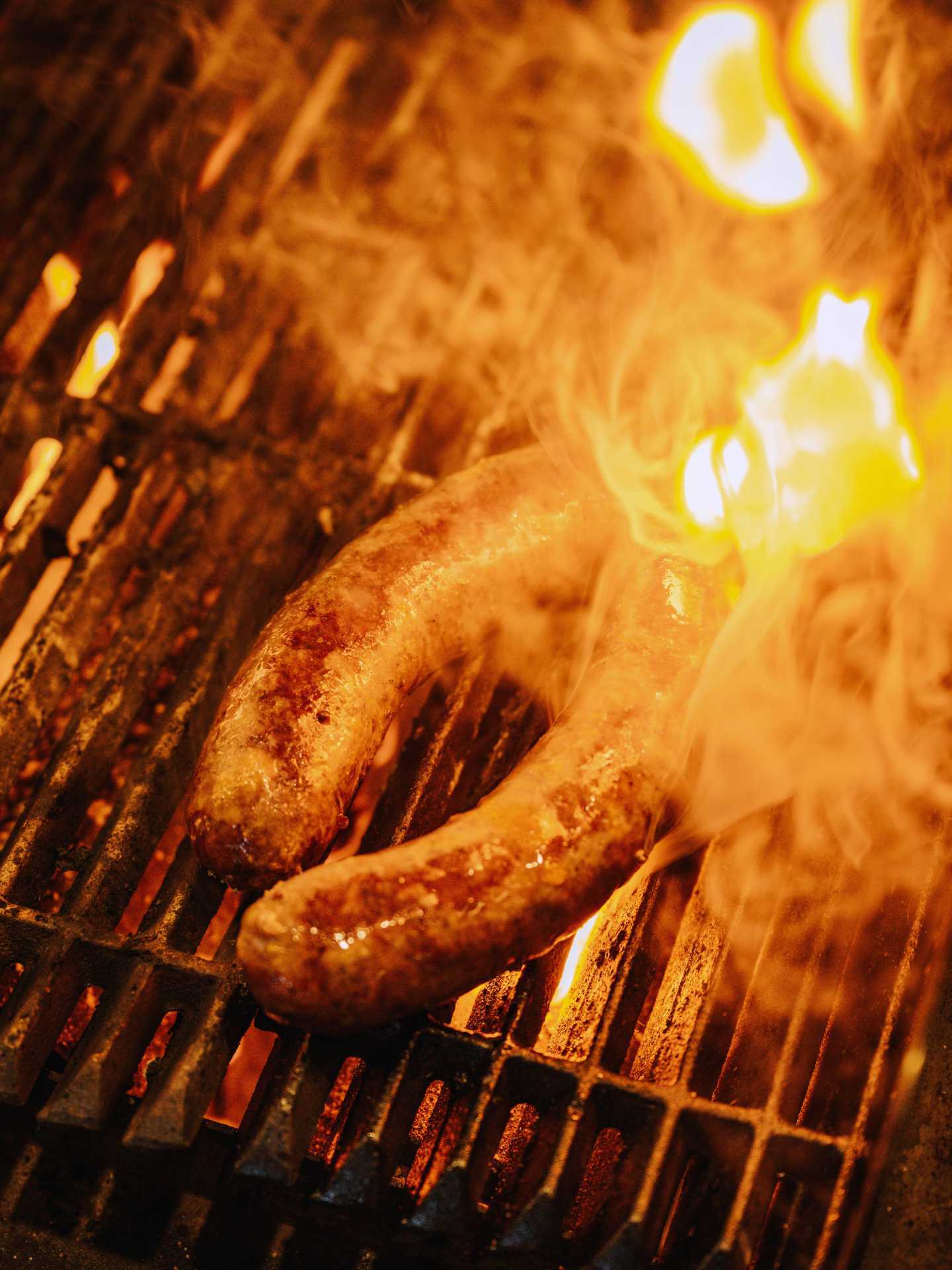 Sausages cooking on the grill at Fat Rabbit in St. Catharines, Ontario
