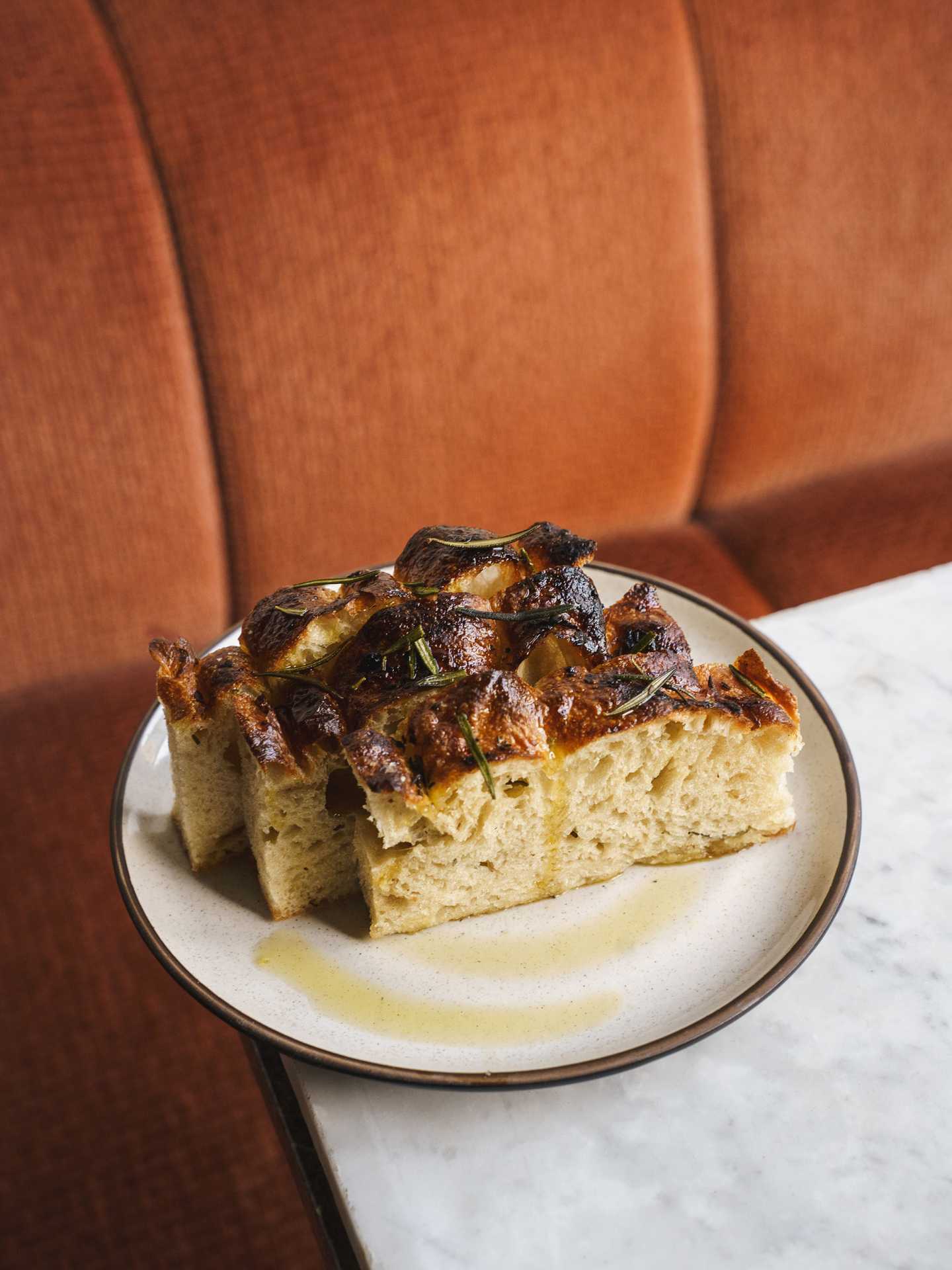 Queer-owned restaurants Toronto | Red fife focaccia at Gia Restaurant