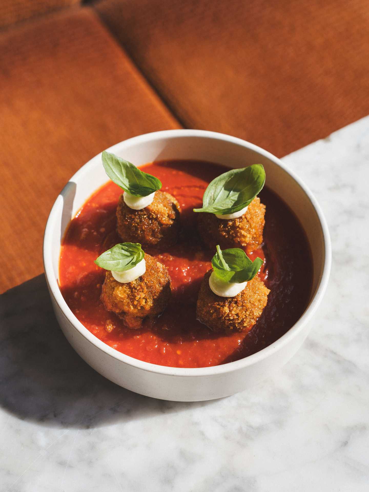 Queer-owned restaurants Toronto | Panko-crusted meatballs at Gia Restaurant