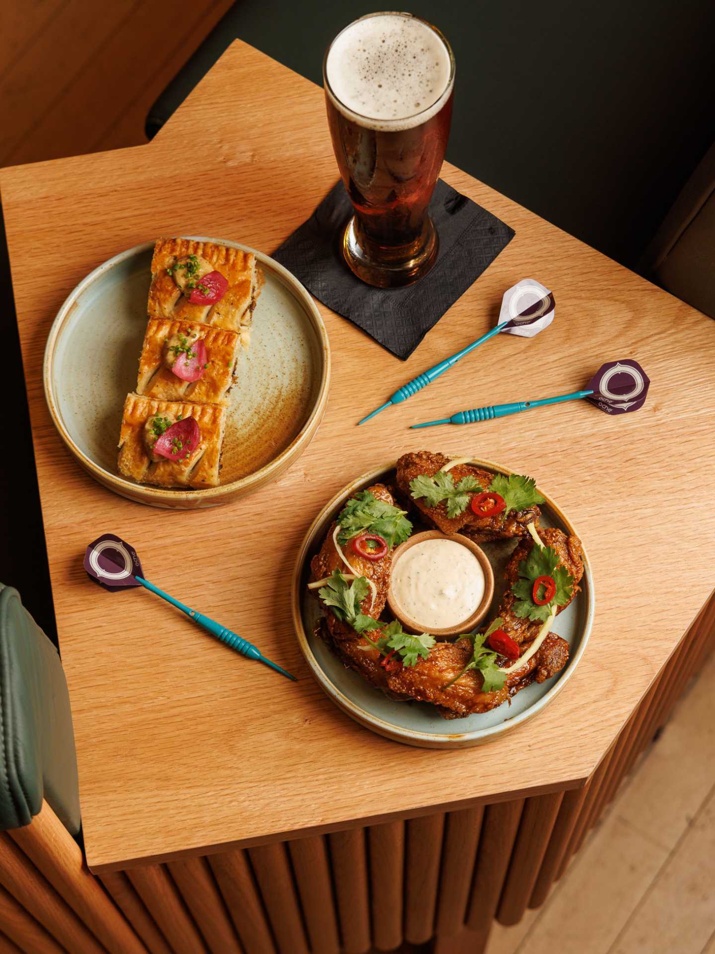 New restaurants Toronto | Assorted plates and darts at Oche