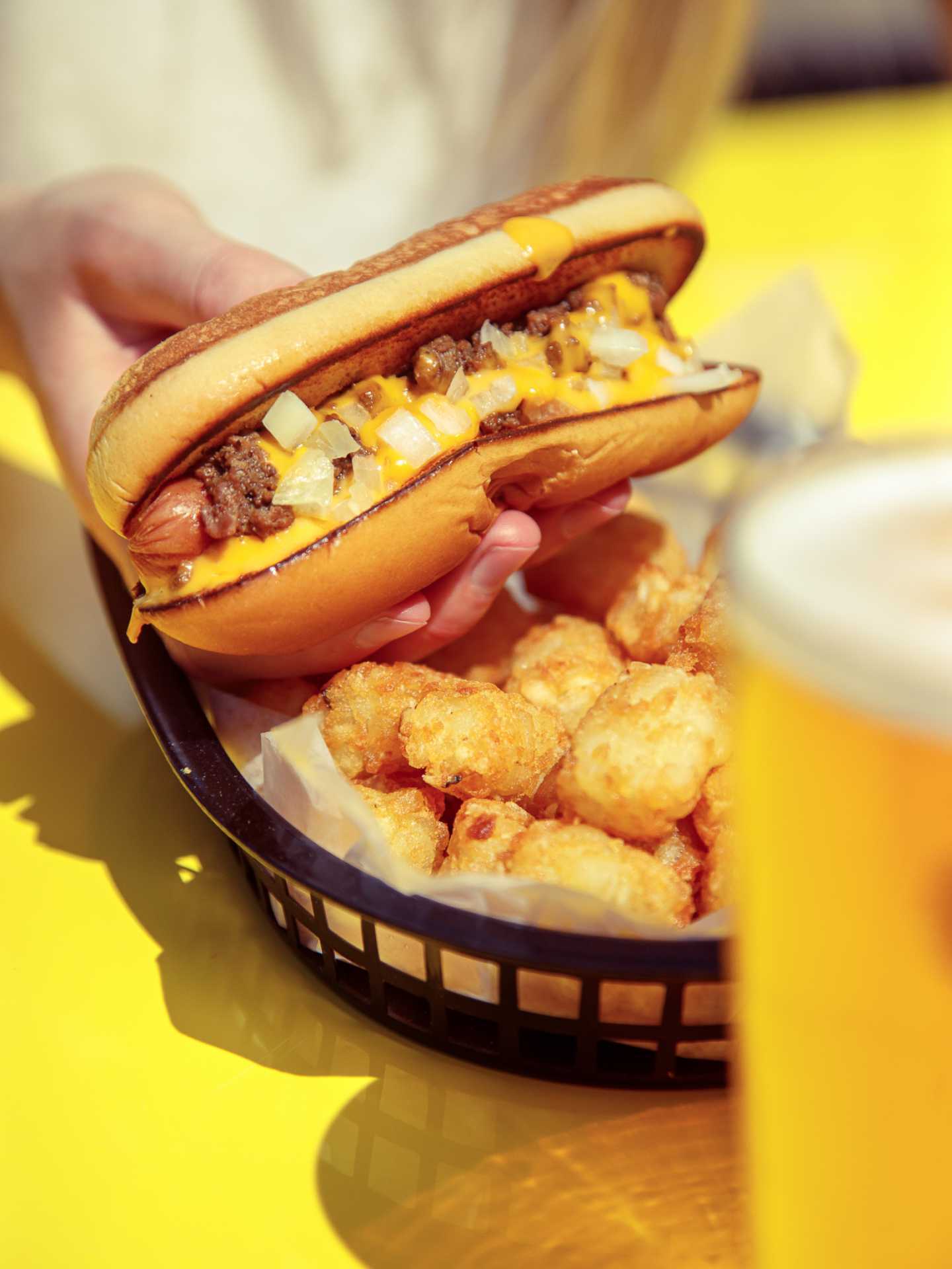The best bars in Toronto | A hot dog and tots at Pennies College