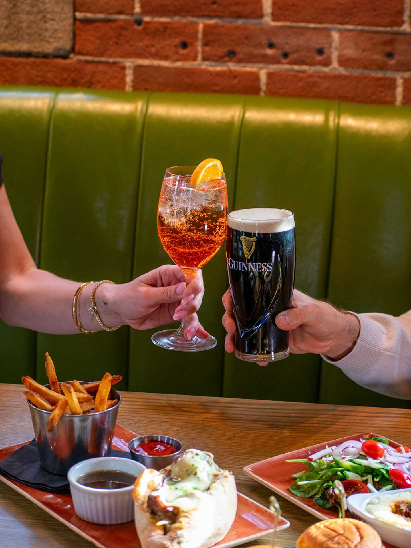 The best Irish pubs in Toronto | Two guests enjoying drinks at Brazen Head