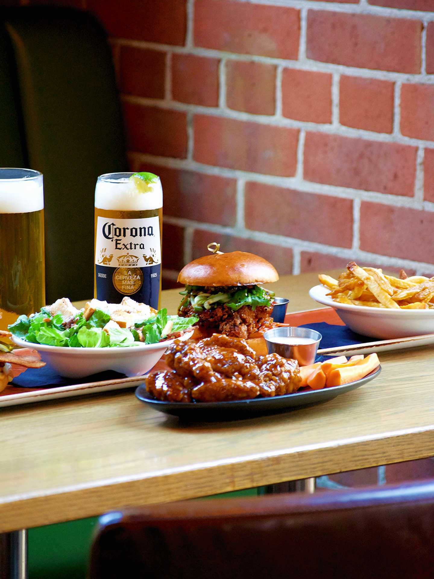 The best Irish pubs in Toronto | Salad, a burger, chicken wings and fries