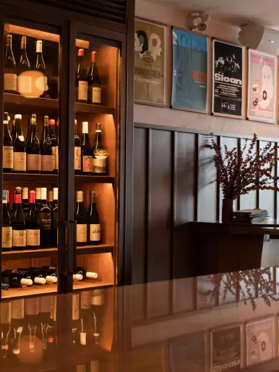 Wine bottles behind the bar at The Wood Owl