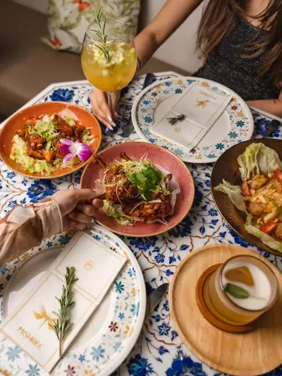 Best new Toronto restaurants | A spread of dishes and cocktails at Mishree
