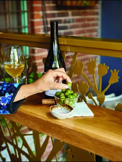Toronto bottle shops and alcohol stores | Eating olives on the patio at Grape Witches
